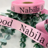 Logo Printed Onto A Pastel Pink Ribbon